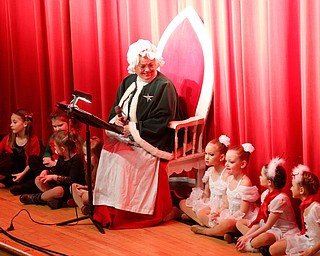 Mrs. Claus reads The Night Before Christmas during The Packard Band annual Christmas Spectacular at W.D. Packard Music Hall on Sunday afternoon. EMILY MATTHEWS | THE VINDICATOR