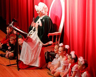 Mrs. Claus reads The Night Before Christmas during The Packard Band annual Christmas Spectacular at W.D. Packard Music Hall on Sunday afternoon. EMILY MATTHEWS | THE VINDICATOR