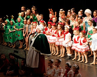 Mrs. Claus and dancers sing We Wish You a Merry Christmas during The Packard Band annual Christmas Spectacular at W.D. Packard Music Hall on Sunday afternoon. EMILY MATTHEWS | THE VINDICATOR