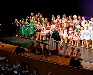 Mrs. Claus and dancers sing We Wish You a Merry Christmas during The Packard Band annual Christmas Spectacular at W.D. Packard Music Hall on Sunday afternoon. EMILY MATTHEWS | THE VINDICATOR