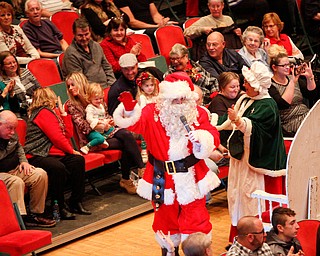 Santa greets the crowd with Mrs. Claus during The Packard Band annual Christmas Spectacular at W.D. Packard Music Hall on Sunday afternoon. EMILY MATTHEWS | THE VINDICATOR