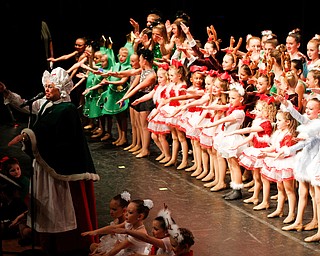 Dancers join Mrs. Claus to sing and dance to the song Baby Shark during The Packard Band annual Christmas Spectacular at W.D. Packard Music Hall on Sunday afternoon. EMILY MATTHEWS | THE VINDICATOR