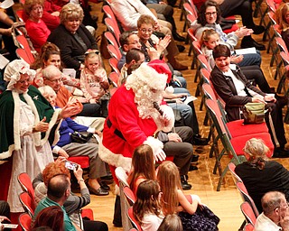 Santa greets the crowd with Mrs. Claus during The Packard Band annual Christmas Spectacular at W.D. Packard Music Hall on Sunday afternoon. EMILY MATTHEWS | THE VINDICATOR