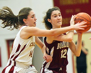 William D. Lewis The Vindicator Mooney's Camden Hergenrother(14) defends against Boardman's Bailey Moore(12) during 12-3-18 action at Mooney.