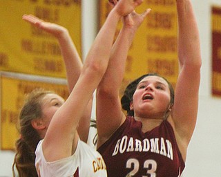 William D. Lewis The Vindicator Board,man's Maria Torres(23) shoots past Mooney's Alaina Scavina(24) during 12-3-18 action at Mooney.