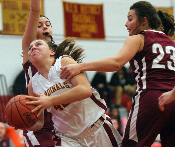 William D. Lewis The Vindicator Mooney's Conchetta Renaldi(42) drives past Boardman's Katie Stamp(41) and Maria Torres(23) during 12-3-18 action at Mooney.