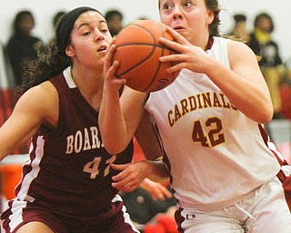 William D. Lewis The Vindicator Mooney's Conchetta Renaldi(42) drives past Boardman's Katie Stamp(41)  during 12-3-18 action at Mooney.