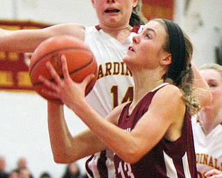 William D. Lewis The VindicatorBoardman's Cate Green(13) shoots past Mooney'sCamden Hergenbother(14) during 12-3-18 action at Mooney.