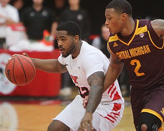 William D. Lewis the Vindicator  YSU'sDevin Morgan(22) drives around CMU's Shawn Roundtree(2) during 12-4-18 action at YSU.