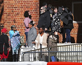 Attendees wait outside the Charlottesville Circuit Courthouse during a recess during the murder trial of James A. Fields Jr. on Nov. 29, 2018, in Charlottesville, Va. Fields is charged with killing a woman and injuring dozens of counterprotesters at a "Unite the Right" rally in Charlottesville on Aug. 12, 2017.