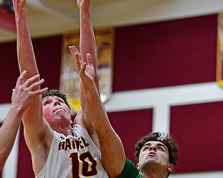 CANFIELD, OHIO - DECEMBER 4, 2018: South Range's Chris Brooks grabs a rebound away from Ursuline's Luke Pipala during the first half of their game, Tuesday night at South Range High School. DAVID DERMER | THE VINDICATOR