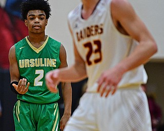 CANFIELD, OHIO - DECEMBER 4, 2018: Ursuline's Daysean Harris embellishes after hitting a three point shot in front of South Range's Jaxon Anderson during the first half of their game, Tuesday night at South Range High School. DAVID DERMER | THE VINDICATOR