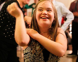 Christin Murcko, 16, a student at Poland High School, dances to the Macarena with other students at the 18th annual Winterfest dance at The Mahoning Country Club on Wednesday night. EMILY MATTHEWS | THE VINDICATOR