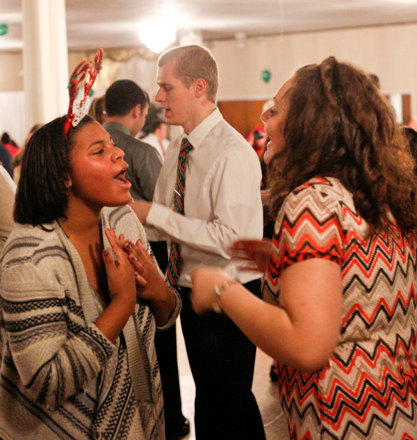 Harmonie Walker, left, 15, a student at Warren G. Harding High School, and Starr Spencer, 16, a student at Potential Development, dance at the 18th annual Winterfest dance at The Mahoning Country Club on Wednesday night. EMILY MATTHEWS | THE VINDICATOR