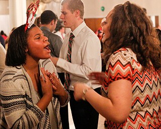 Harmonie Walker, left, 15, a student at Warren G. Harding High School, and Starr Spencer, 16, a student at Potential Development, dance at the 18th annual Winterfest dance at The Mahoning Country Club on Wednesday night. EMILY MATTHEWS | THE VINDICATOR