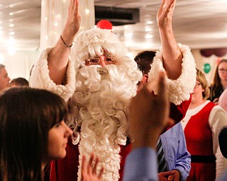 Santa dances with students at the 18th annual Winterfest dance at The Mahoning Country Club on Wednesday night. EMILY MATTHEWS | THE VINDICATOR