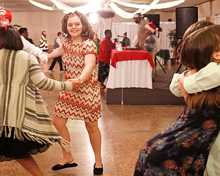 Starr Spencer, center, 16, a student at Potential Development, dances with other students while Katelyn Hall, 16, and Chad Berry, 15, both students at Fitch, hug on the dance floor at the 18th annual Winterfest dance at The Mahoning Country Club on Wednesday night. EMILY MATTHEWS | THE VINDICATOR