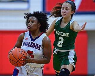 AUSTINTOWN, OHIO - DECEMBER 5, 2018: Fitch's Jada Lazaro looks to pass after dribbling past Ursuline's Rachel Fabry during the first half of their game, Wednesday night at Austintown Fitch High School. DAVID DERMER | THE VINDICATOR