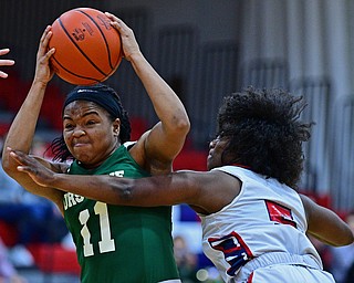 AUSTINTOWN, OHIO - DECEMBER 5, 2018: Ursuline's DayShanette Harris drives on Fitch's Jada Lazaro during the second half of their game, Wednesday night at Austintown Fitch High School. DAVID DERMER | THE VINDICATOR