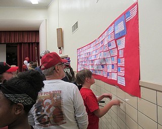 Neighbors | Jessica Harker.Students at Market Street Elementary School in Boardman created American flags that were hung on the wall of cafeteria on Nov. 9 for the school's annual Veterans Day Assembly.