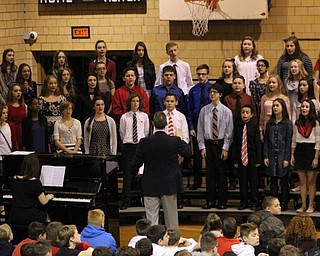 Neighbors | Abby Slanker.As the Canfield Cambiata performed “Salute to Armed Forces” at the Canfield Village Middle School’s annual Veterans Day Assembly, veterans in attendance stood and were recognized when the song from their branch of the military was presented.