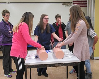 Neighbors | Jessica Harker.Health teacher Karen Mincher looked on as Mercy Health representative Haley Bajdas taught students how to properly pack a wound Nov. 14.