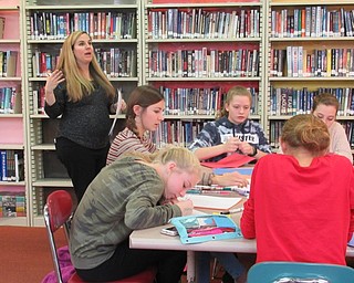 Neighbors | Jessica Harker.Poland Middle School Counselor Mary Jo Rowan instructed student members of the Kindness Club on their Thanksgiving projects.