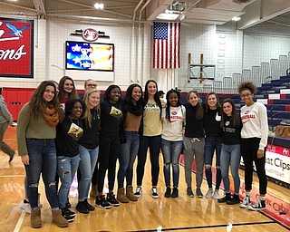 Neighbors | Submitted.Austintown Fitch girls basketball team members surrounded senior Sabrina Hunter after Hunter signed her letter of intent on Nov. 20 to attend West Point Military Academy.