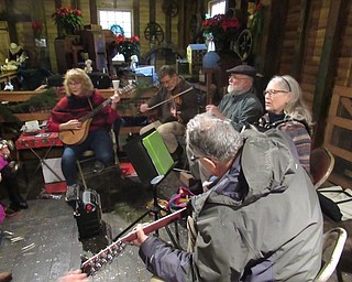 Neighbors | Jessica Harker.One String Short performed classic Christmas songs with community members during Mill Creek Park's annual Olde Fashion Christmas event on Nov. 24.