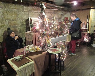 Neighbors | Jessica Harker.Patti White of Country Copper and Tin set up her table as a vendor during the annual Olde Fashion Christmas event at Lanterman's Mill on Nov. 24.