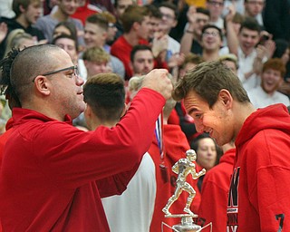 William D. Lewis The Vindicator   Girard AD Nick Cochran present Girard QB MArk Waid a medal during a 12-6-18 event at Girard HS honoring the 2018 state runners up football team.