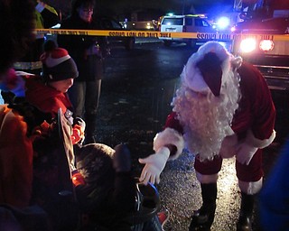 Neighbors | Jessica Harker.Santa Claus greeted children outside of the Fire Station on Wickliffe Circle in Austintown Nov. 30 for the annual tree lighting event.