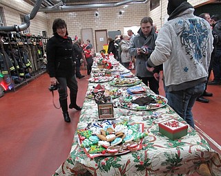 Neighbors | Jessica Harker.Cookies purchased with money donated by community members were available to people who attended the 31st annual tree lighting event at the Austintown Fire Department on Nov. 29.