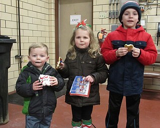 Neighbors | Jessica Harker.Blake, Brooke and Brock Palkovich enjoyed cookies at the 31st annual tree lighting event at the Austintown Fire Department on Nov. 29.