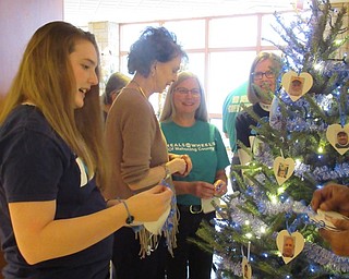 Neighbors | Jessica Harker.Brittany Bailing, Caren Barr, Chris Downie and Kathy Esseniyi from Meals on Wheels decorate a Christmas Tree dedicated to Boardman Subaru for partenering with them for their annual Share the Love event.