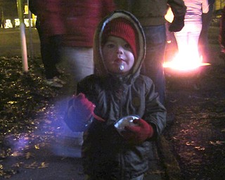 Neighbors | Jessica Harker.Raymond Smith enjoyed a bowl of ice cream outside of Dairy Queen during Canfield's annual Lighting of the Green.