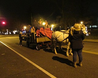 Neighbors | Jessica Harker.Horse-drawn carriage rides took community members around the Canfield Green on Nov. 30 for Canfield's annual Lighting of the Green event.