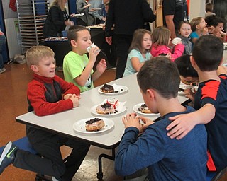 Neighbors | Jessica Harker.Students enjoyed free treats that were hand dipped by staff at Poland Union Elementary School on Nov. 30.