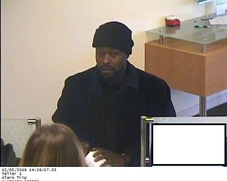 Austintown detectives are seeking more information on the suspect in a Wednesday bank robbery.