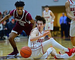 NILES, OHIO - DECEMBER 7, 2018: Niles' Trent Johnson and Boardman's Daeone Martin scramble for a loose ball at mid-court during the second half of their game, Friday night at Niles McKinley High School. DAVID DERMER | THE VINDICATOR