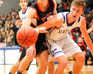 Canfield's Kyle Gamble and Poland's Collin Todd go after the ball during their game at Poland Seminary High School on Saturday night. EMILY MATTHEWS | THE VINDICATOR