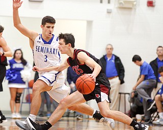 Canfield's Brayden Beck dribbles the ball while Poland's Braeden O'Shaughnessy tries to block him during their game at Poland Seminary High School on Saturday night. EMILY MATTHEWS | THE VINDICATOR