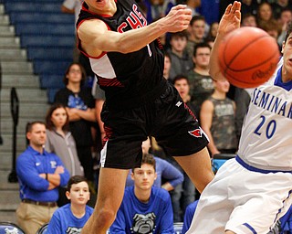 Canfield's Aydin Hanousek keeps the ball in bounds during their game against Poland at Poland Seminary High School on Saturday night. EMILY MATTHEWS | THE VINDICATOR