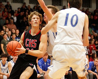 Canfield's Kyle Gamble looks to pass the ball while Poland's Collin Todd and Daniel Kramer (10) try to block him during their game at Poland Seminary High School on Saturday night. EMILY MATTHEWS | THE VINDICATOR