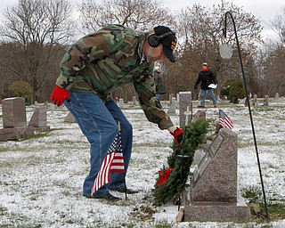 Vietnam veteran Stan Baytos of Berlin Center lays a wreath at the grave site of a veteran at the North Jackson Cemetary on Saturday morning. Dustin Livesay  |  The Vindicator  12/8/18  North Jackson