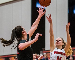 DIANNA OATRIDGE | THE VINDICATOR  Youngstown State's Melinda Trimmer (14) shoots a jumper over St. Francis defender Courtney Zezza (32) during their game at Beeghly Center on Saturday.