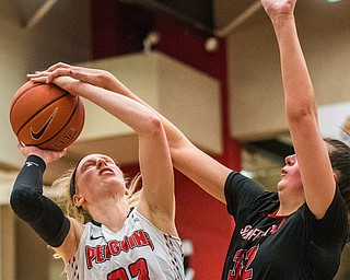 DIANNA OATRIDGE | THE VINDICATOR  Youngstown State's Sarah Cash (23) gets fouled by St. Francis' Courtney Zezza (32) as she puts up a shot during their game at Beeghly Center on Saturday.