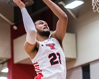 DIANNA OATRIDGE | THE VINDICATOR  Youngstown State's  Olamide Pedersen (23) elevates to the basket during their game against Western Michigan at Beeghly Center on Saturday.