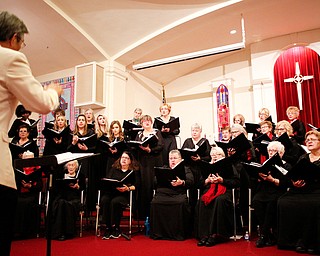 The Stambaugh Chorus performs Cantate Domino under the direction of Dr. Hae-Jong Lee as part of the Concerts Under the Dome at First Presbyterian Church in Columbiana on Sunday night. EMILY MATTHEWS | THE VINDICATOR