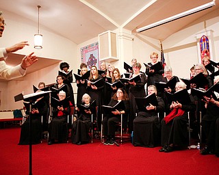 The Stambaugh Chorus performs Cantate Domino under the direction of Dr. Hae-Jong Lee as part of the Concerts Under the Dome at First Presbyterian Church in Columbiana on Sunday night. EMILY MATTHEWS | THE VINDICATOR